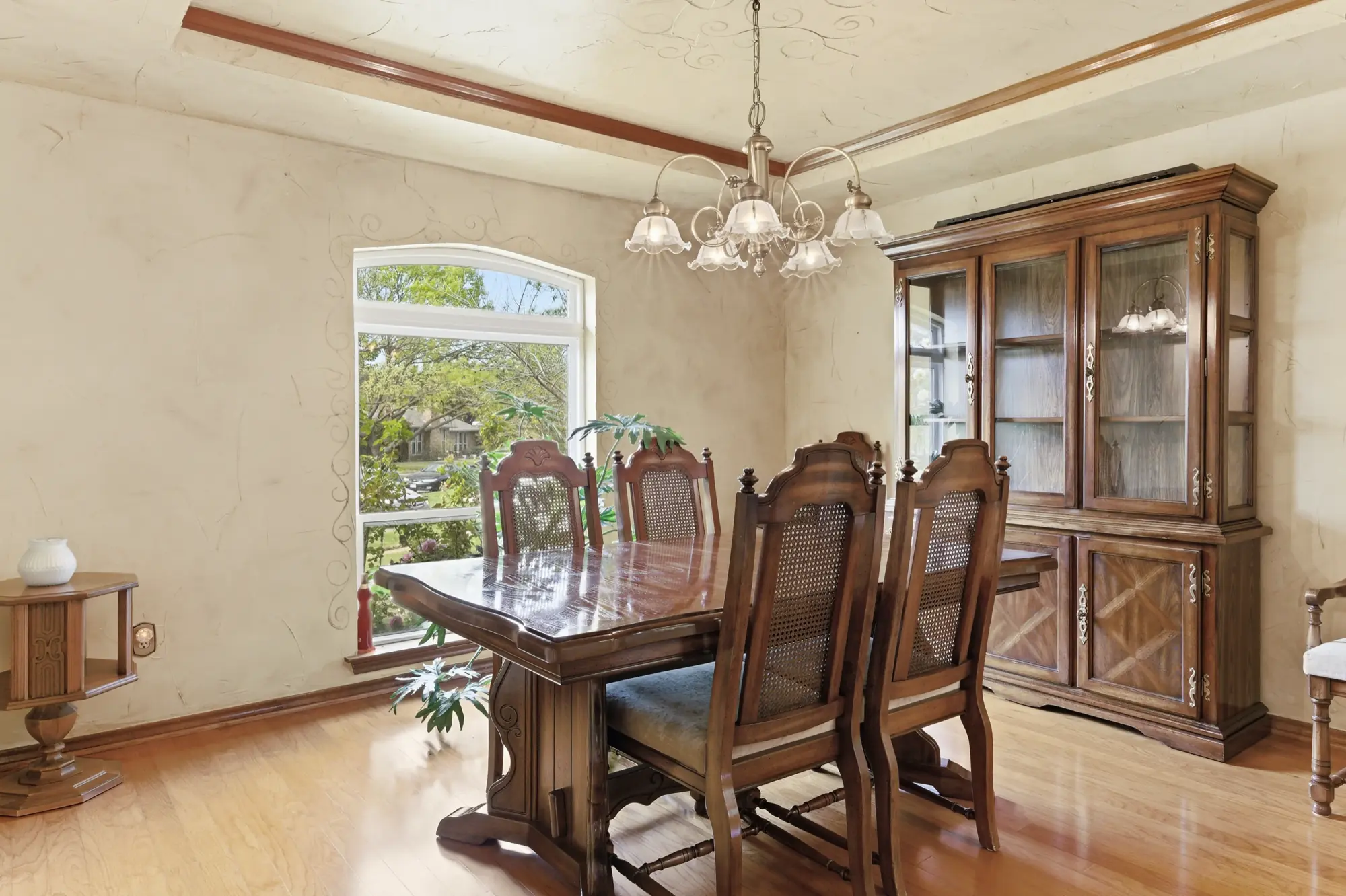 Formal dining room with arched window